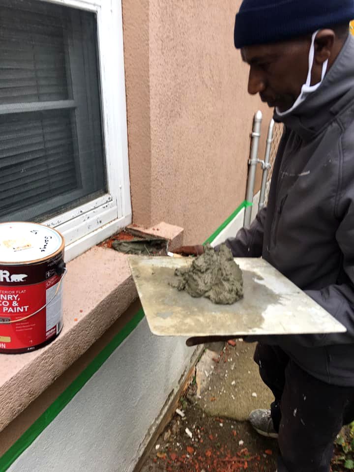 Concrete repair on a porch before coating